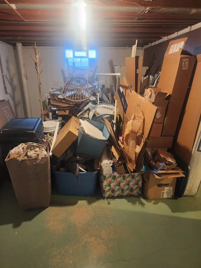 Roll-off dumpster container at job site for 2 Yard Dumpster Rental in Twin Lakes